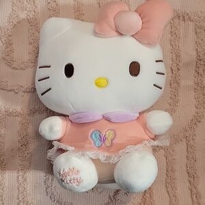 Hello Kitty Plush Doll, NWOT. Peach, purple and white.